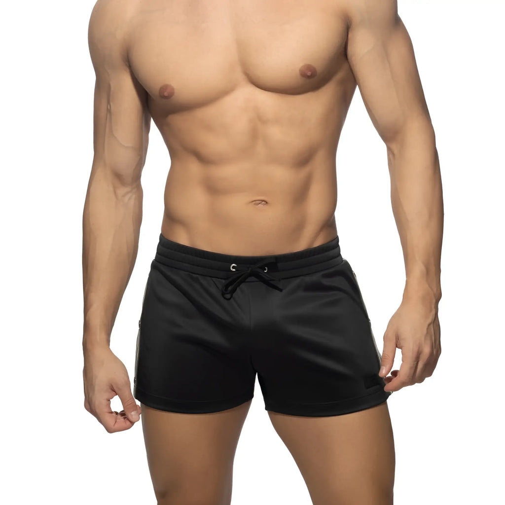 Black Nexus Button athletic shorts with drawstring waistband and subtle side stripes for comfortable active wear