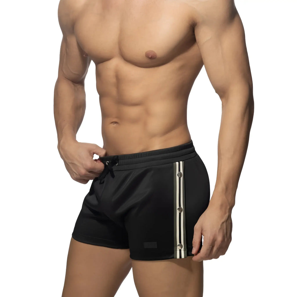 Black nexus button shorts with white and gray vertical stripes and a drawstring waistband for athletic use
