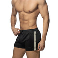 Black nexus button shorts with white and gray vertical stripes and a drawstring waistband for athletic use