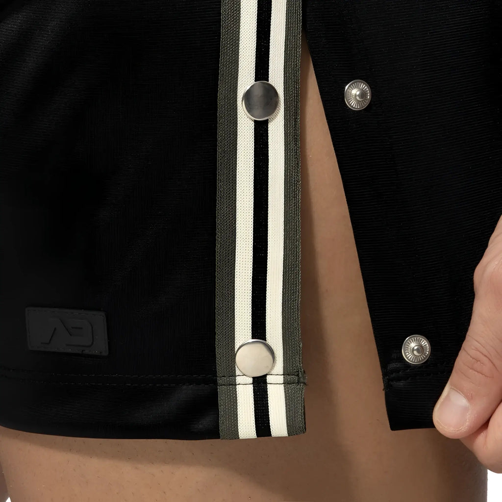 Black varsity jacket with olive and white striped placket and silver snap buttons for casual wear