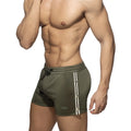 Nexus Button Shorts olive green athletic shorts with white and black vertical stripes silver buttons and drawstring waistband