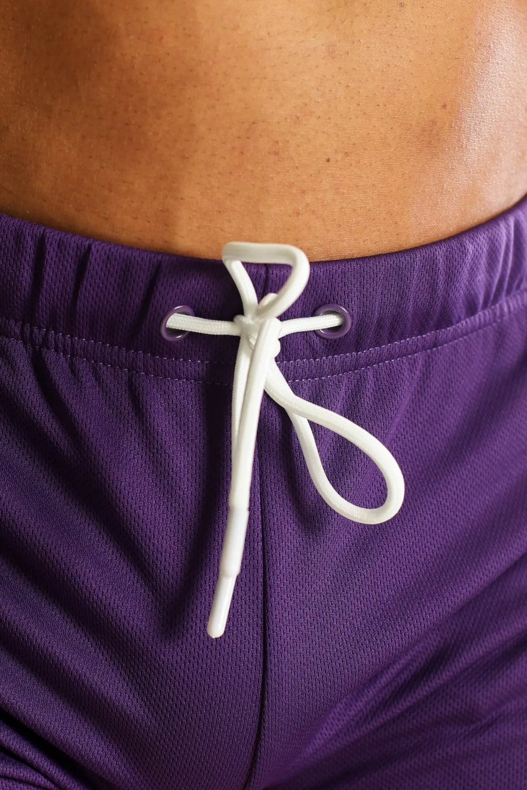 Purple for-the-night 2 inch gym shorts with white drawstring tied at waistband in dark plum color