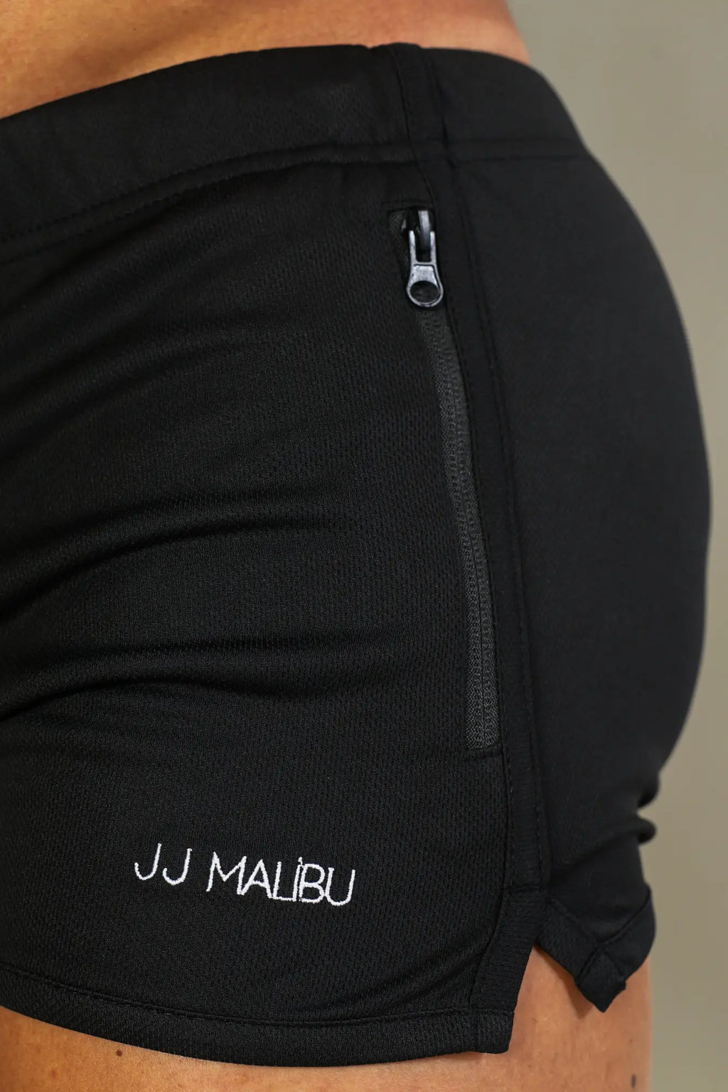 Black 2 inch gym shorts with drawstring side zipper and jj malibu embroidery on lower leg in obsidian black
