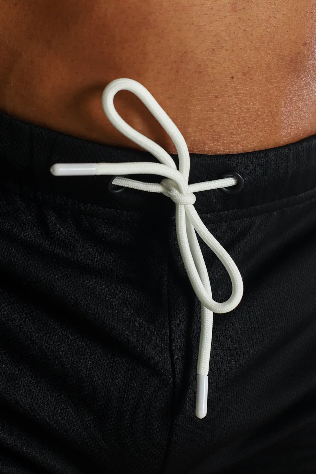 For-the-night 2 inch gym short shorts in obsidian black with white drawstring tied at the waistband