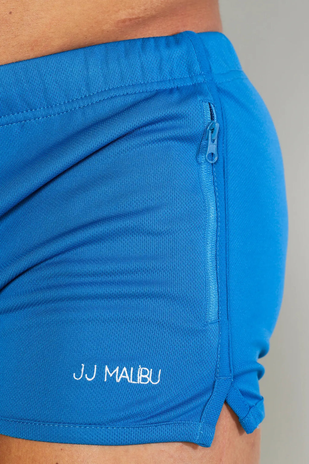 Bright blue for-the-night 2 inch gym shorts with drawstring zipper and white jj malibu branding on lower leg