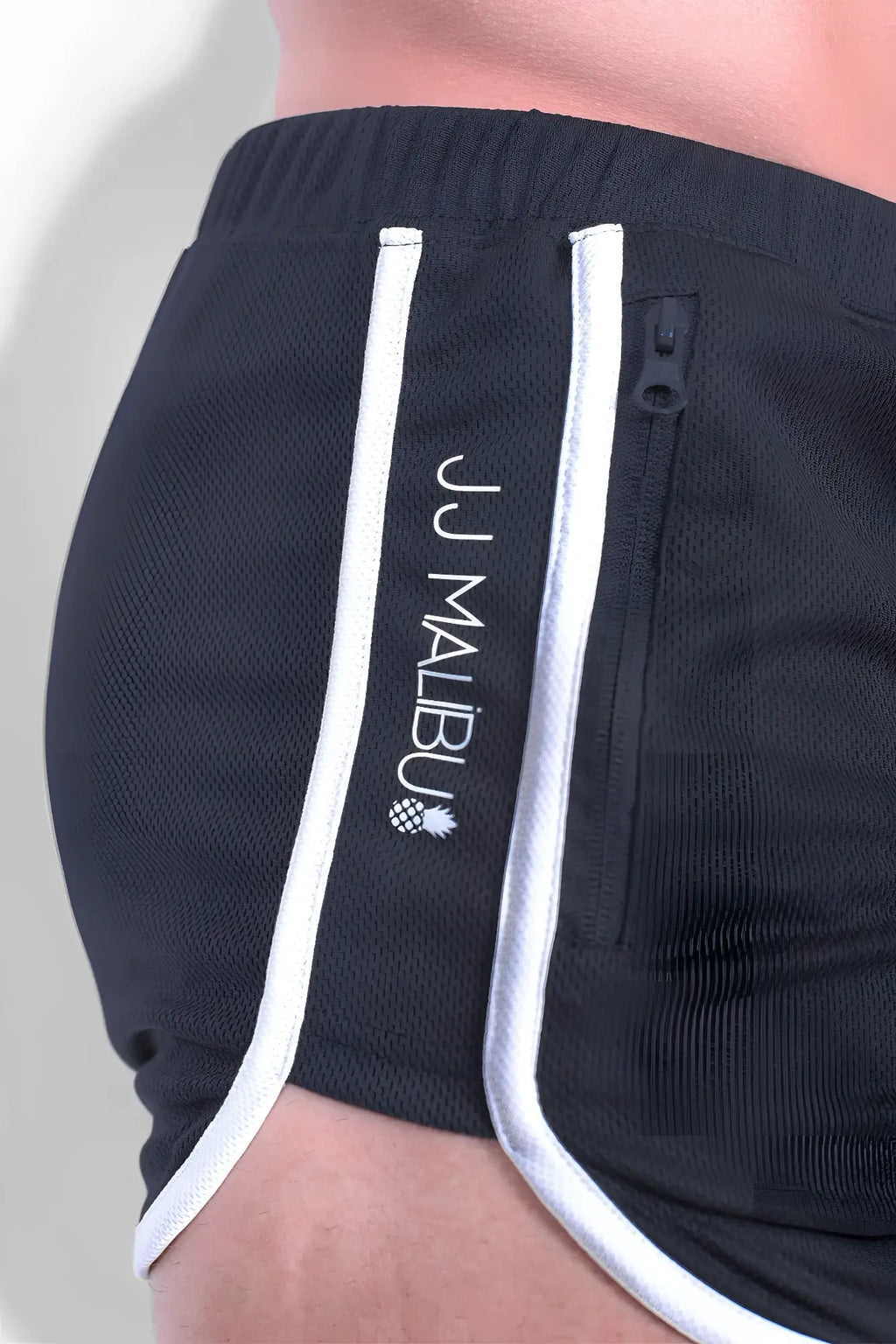 Black athletic shorts with white piping and side zip pocket embroidered with jj malibu logo in smokey grey fabric