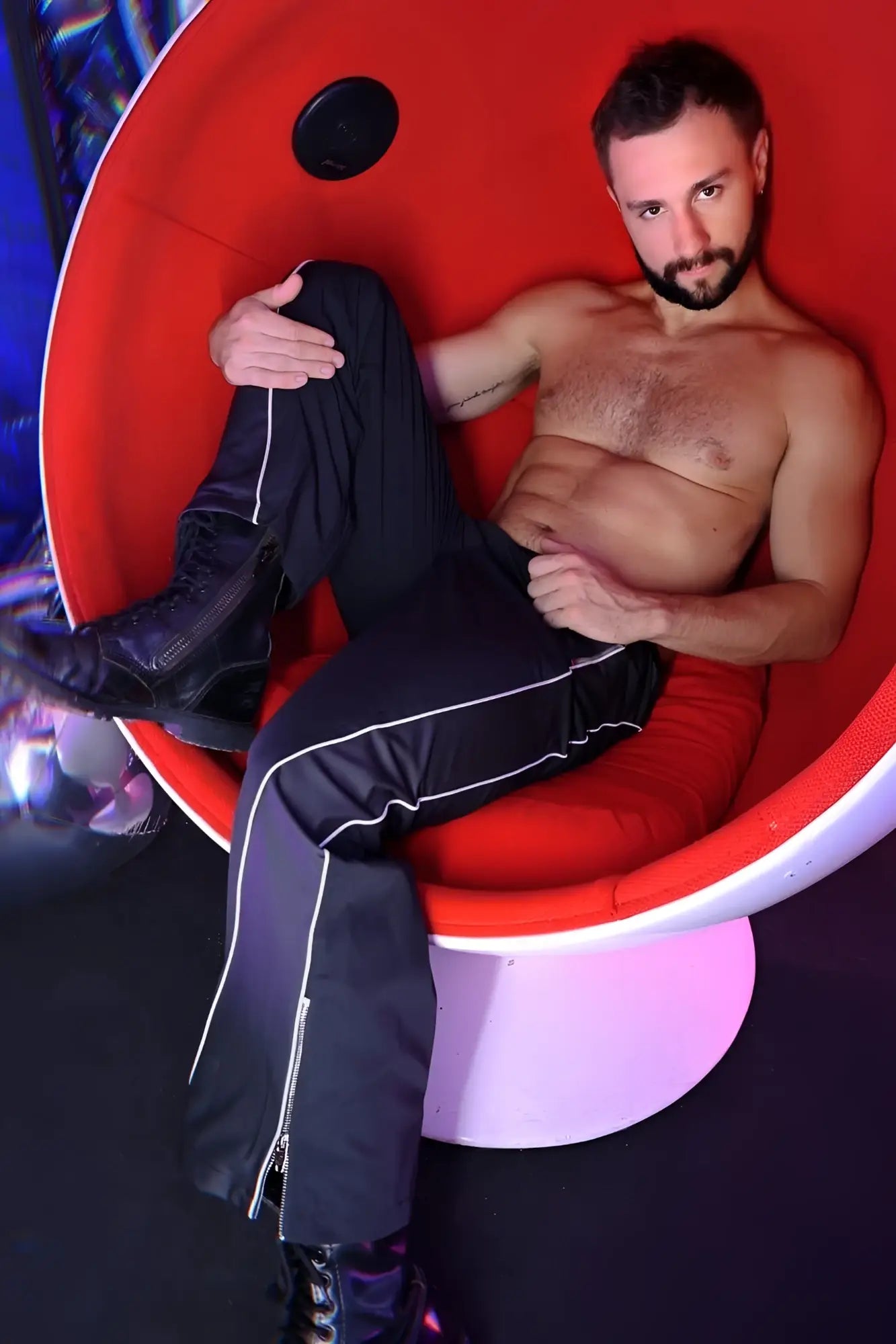 Black nsa track pants with white side stripes and zipper detail made for athletic use