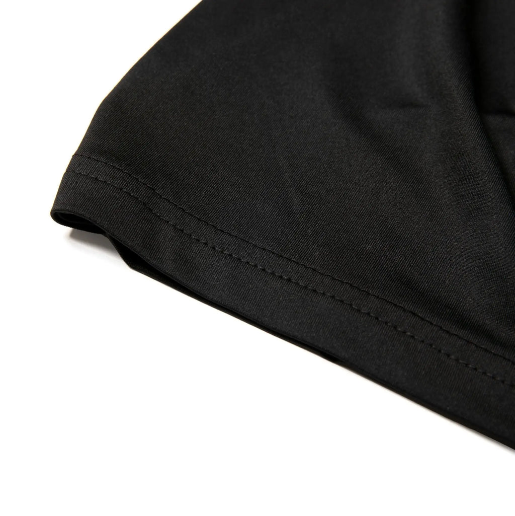 Black cotton sleeve with neatly stitched hem on nylon active underwear crew neck t-shirt