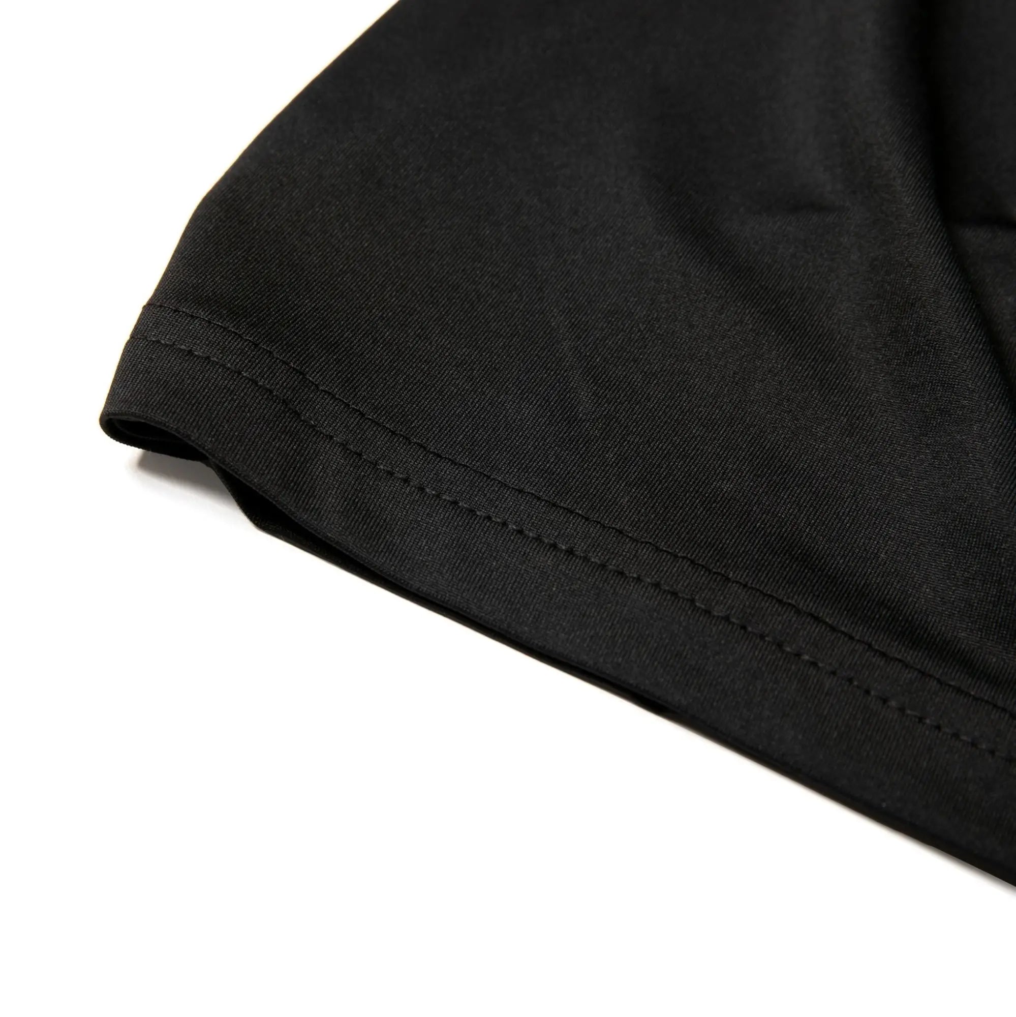 Black nylon active tank top sleeve with neatly stitched hem designed for comfort and durability