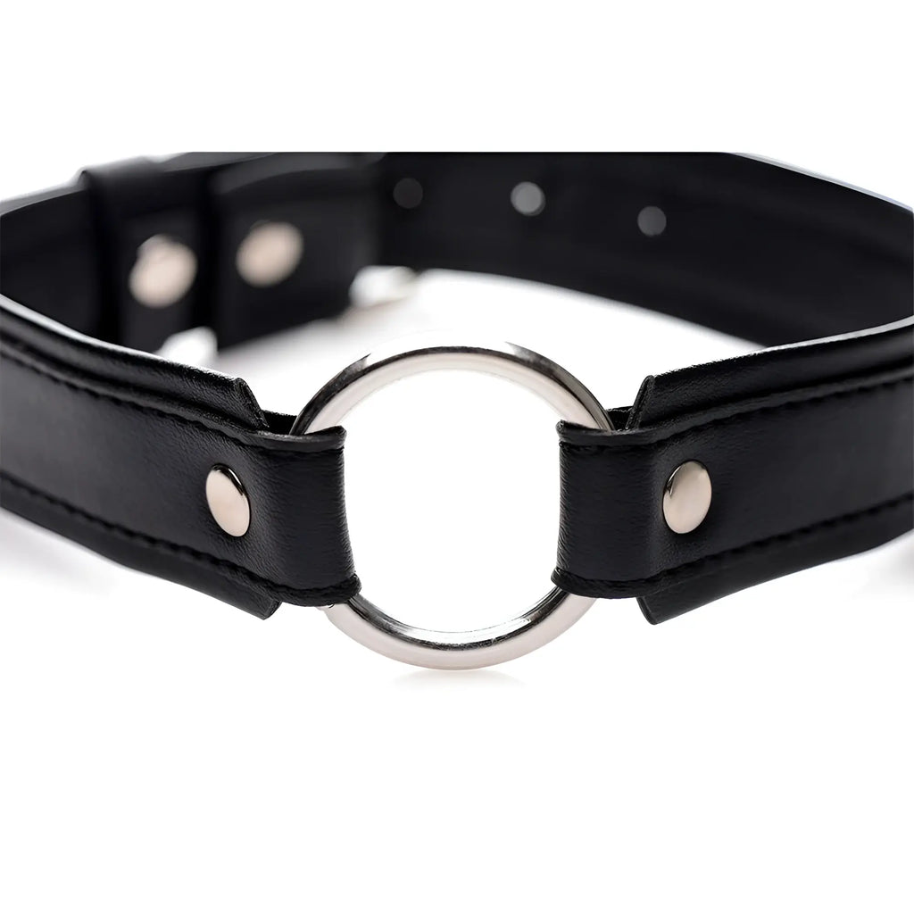 Black leather o-ring collar with silver toned metal ring and matching rivets designed for edgy fashion statements