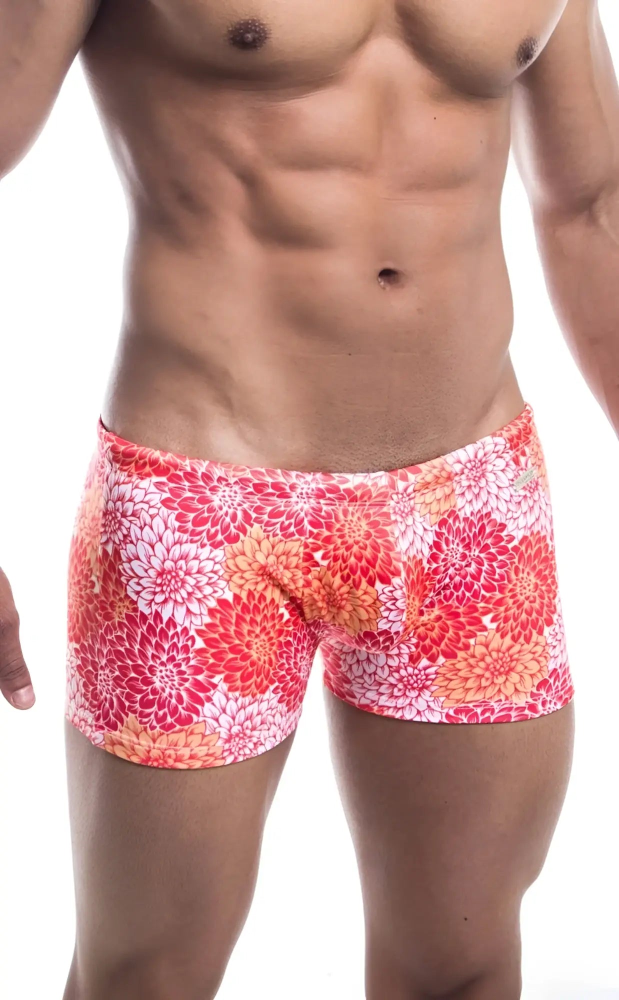 Oceanico square cut swim trunks with vibrant coral and white floral pattern and snug form fitting design