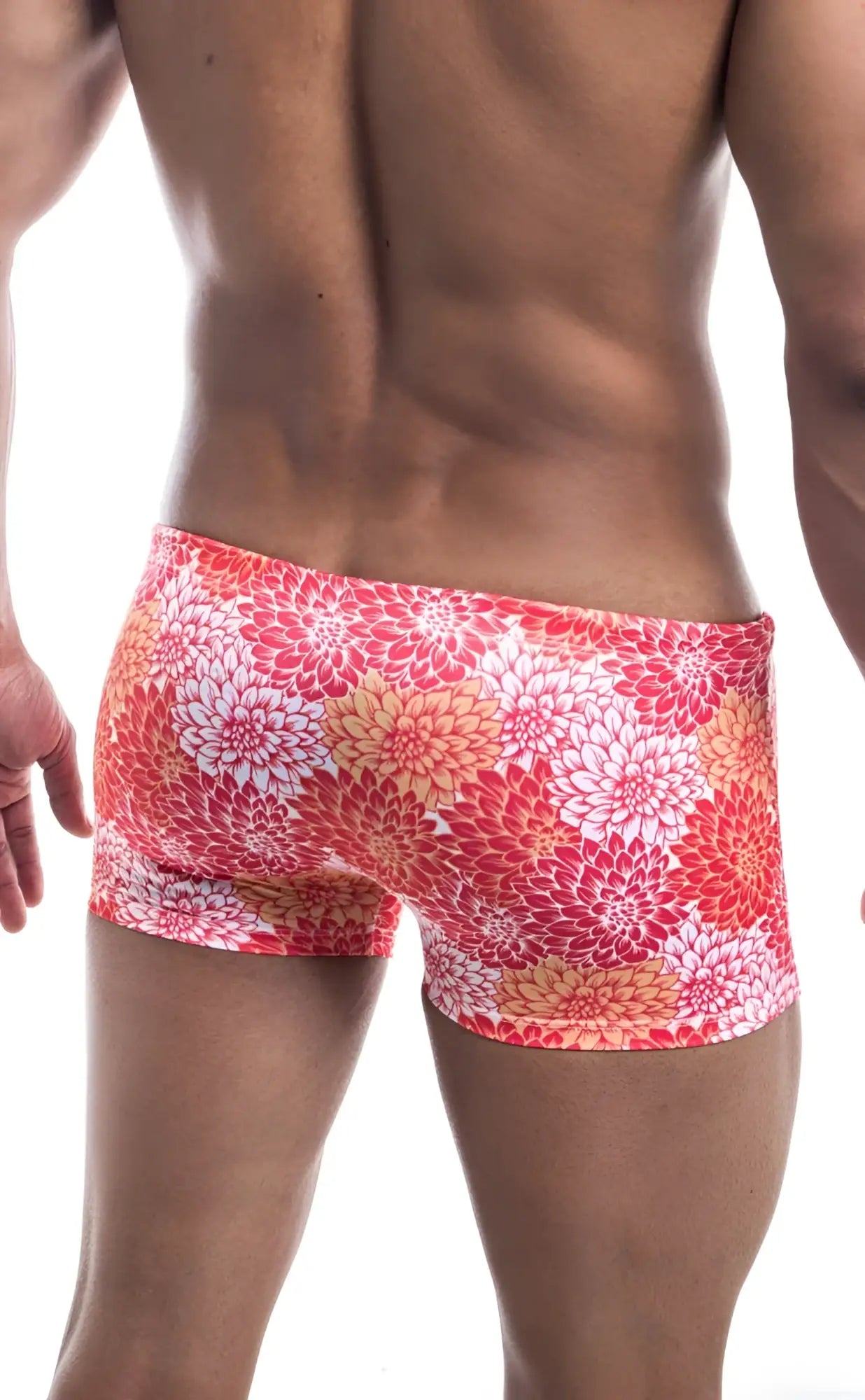 Oceanico square cut swim trunks with vibrant coral and white floral pattern and a snug high-waisted fit