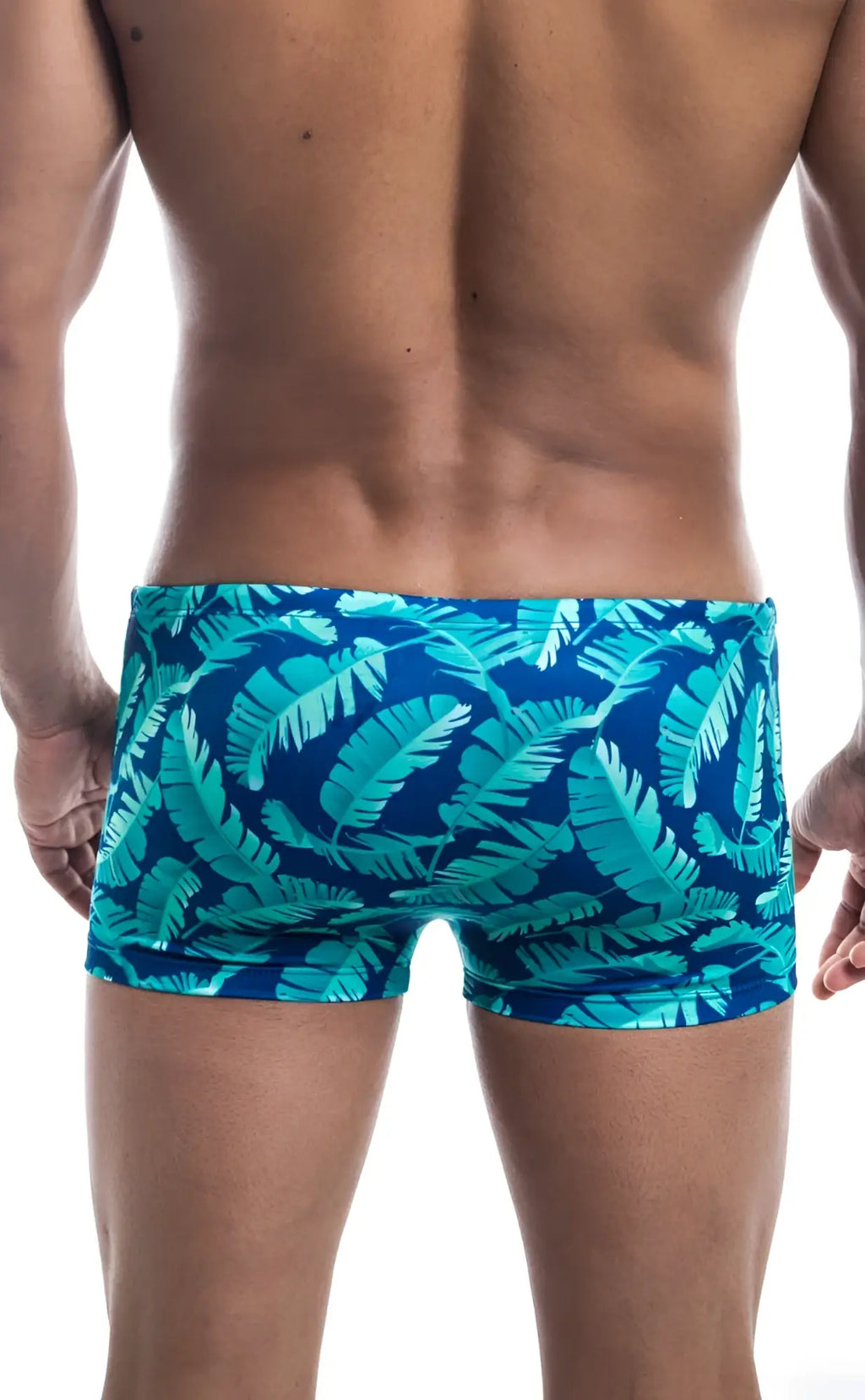 Oceanico square cut swim trunks featuring vibrant turquoise and deep blue tropical leaf pattern for beachwear