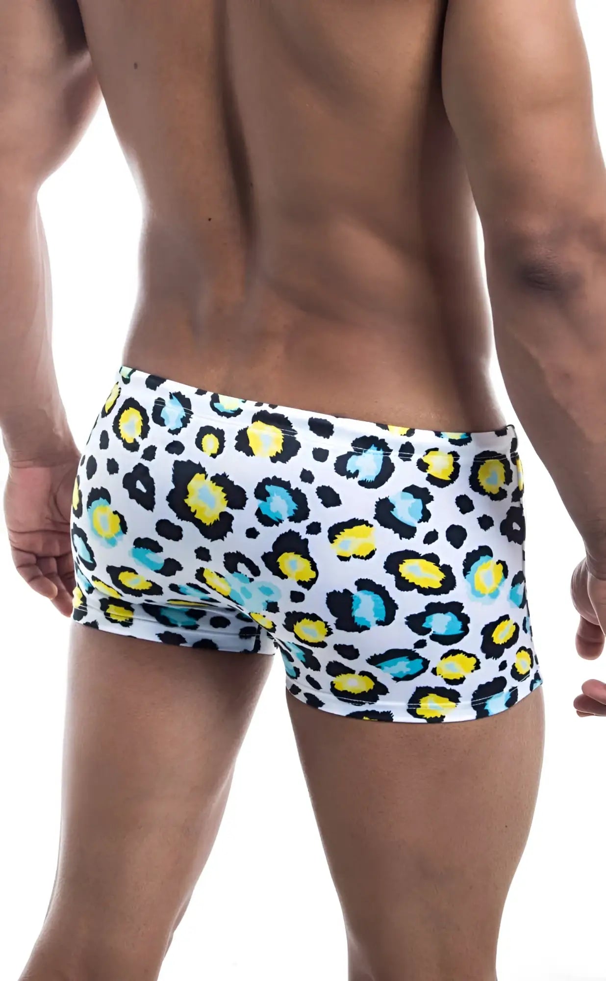 Oceanico square cut white swim trunks with bold leopard print featuring yellow and teal spots for beachwear