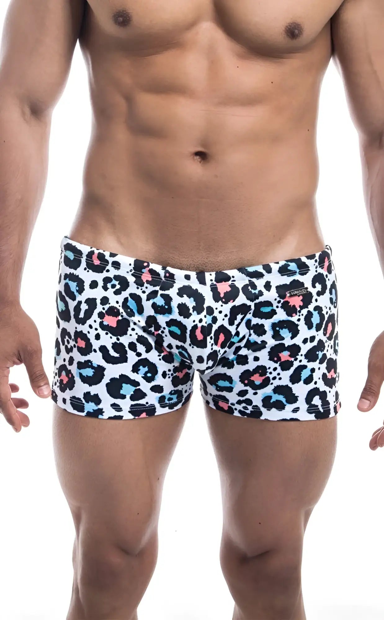 White Oceanico Square Cut swim trunks with bold leopard print in black pink and teal spots perfect for beachwear