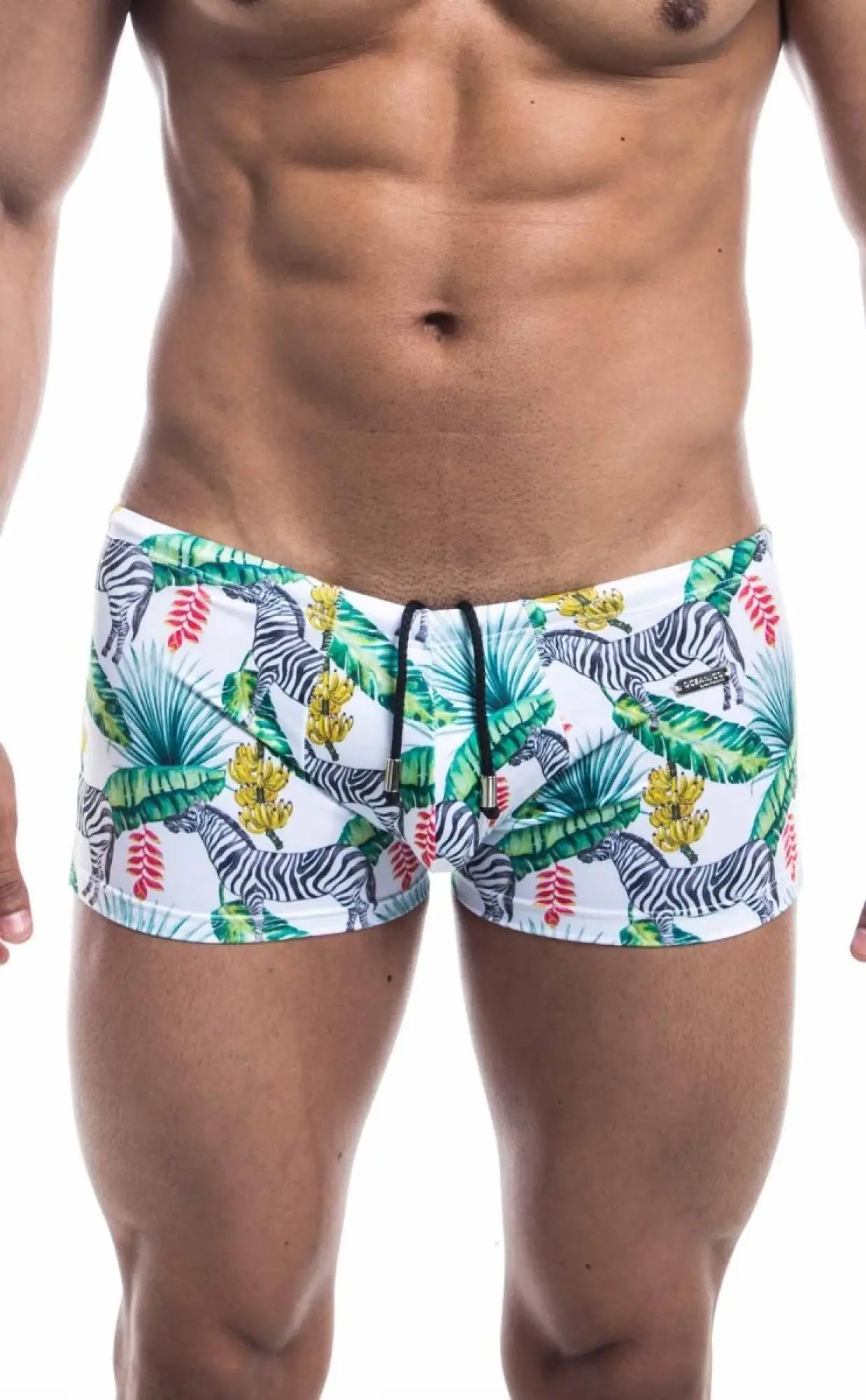 Oceanico square cut white swim trunks with vibrant tropical pattern featuring black and white zebras green palm leaves and yellow flowers