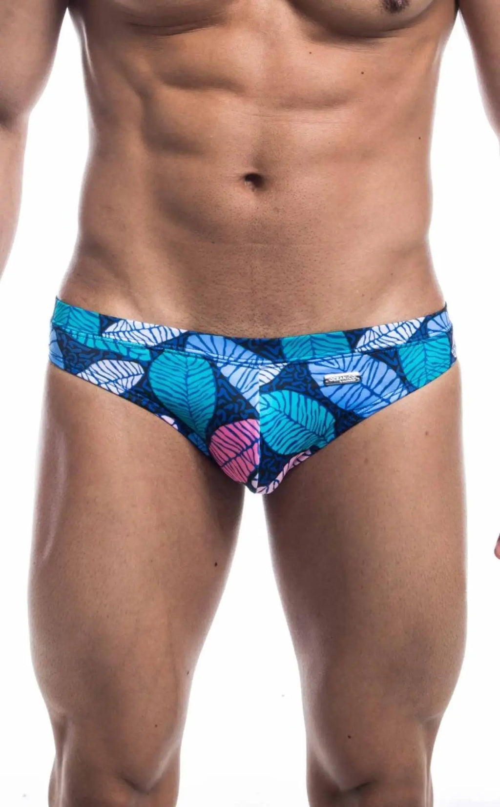 Oceanico swim bikini featuring blue and pink leaf-patterned swim trunks with a vibrant tropical design