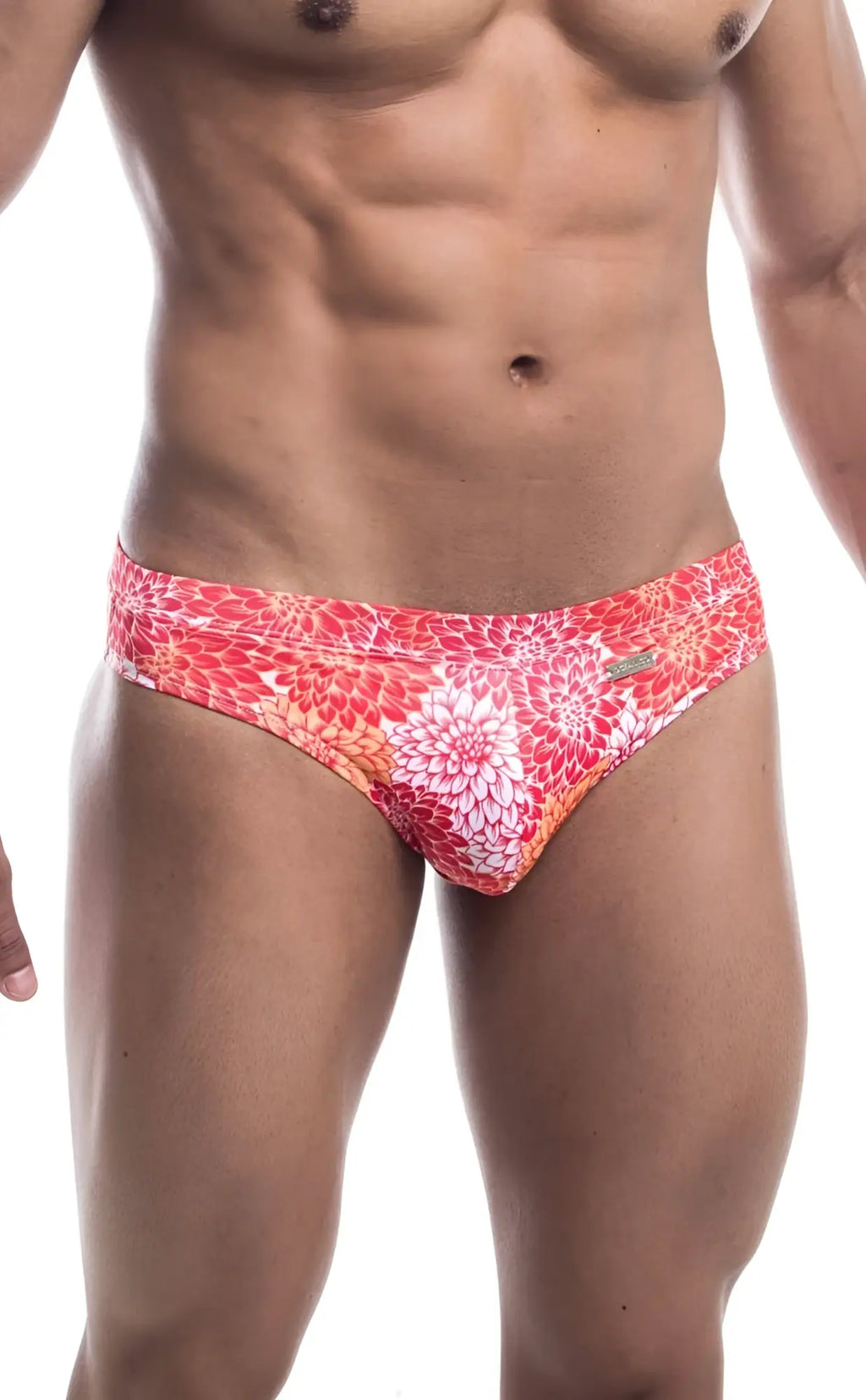 Oceanico swim bikini featuring vibrant coral and white floral-patterned swim trunks with sleek modern design