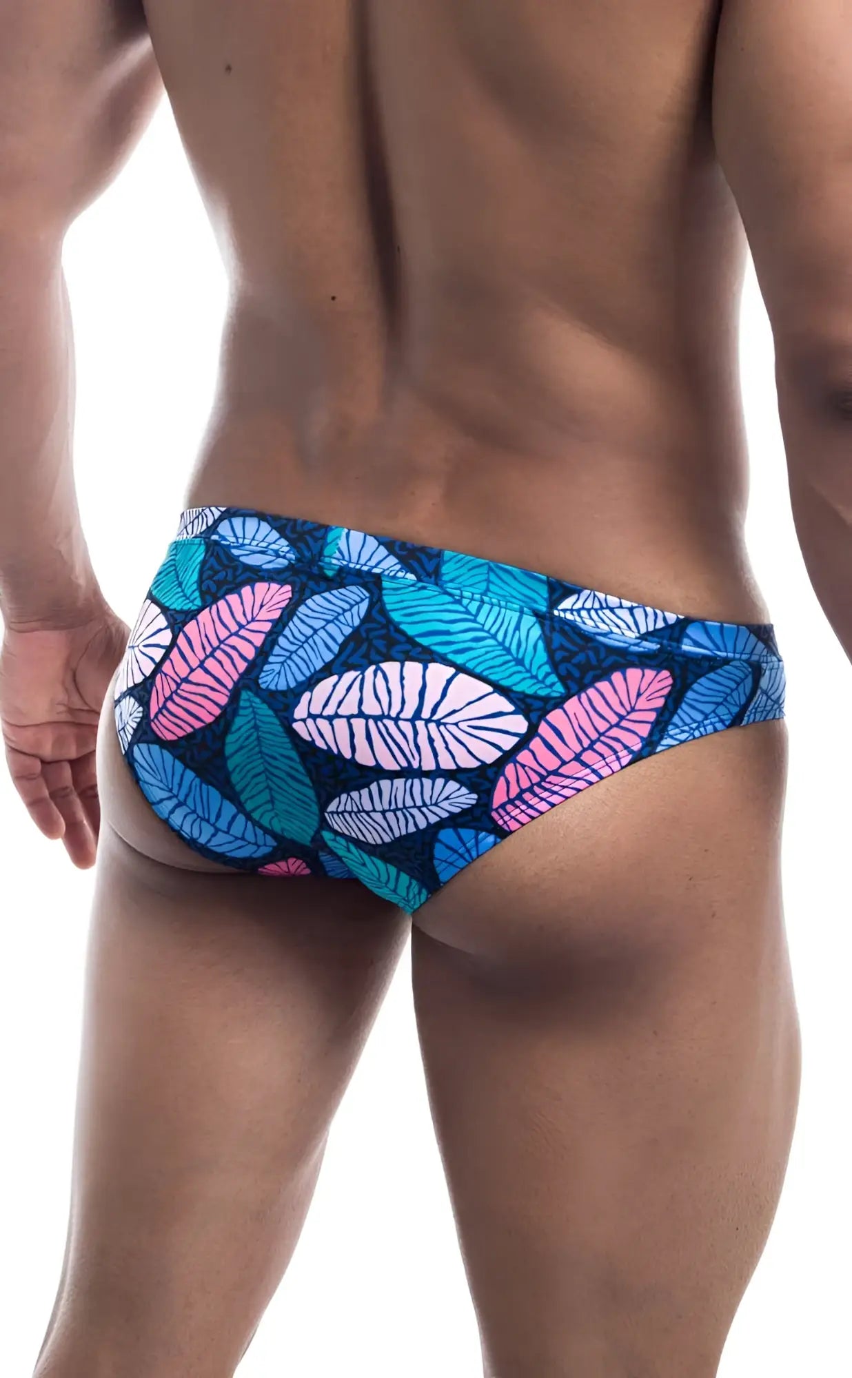 Oceanico swim bikini with vibrant tropical leaf-patterned swim trunks in pink teal and white on dark blue base