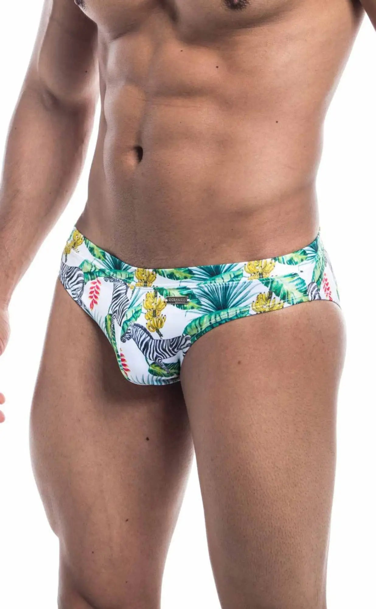 White Oceanico swim bikini trunks with vibrant tropical zebra pattern green palm leaves and yellow flowers