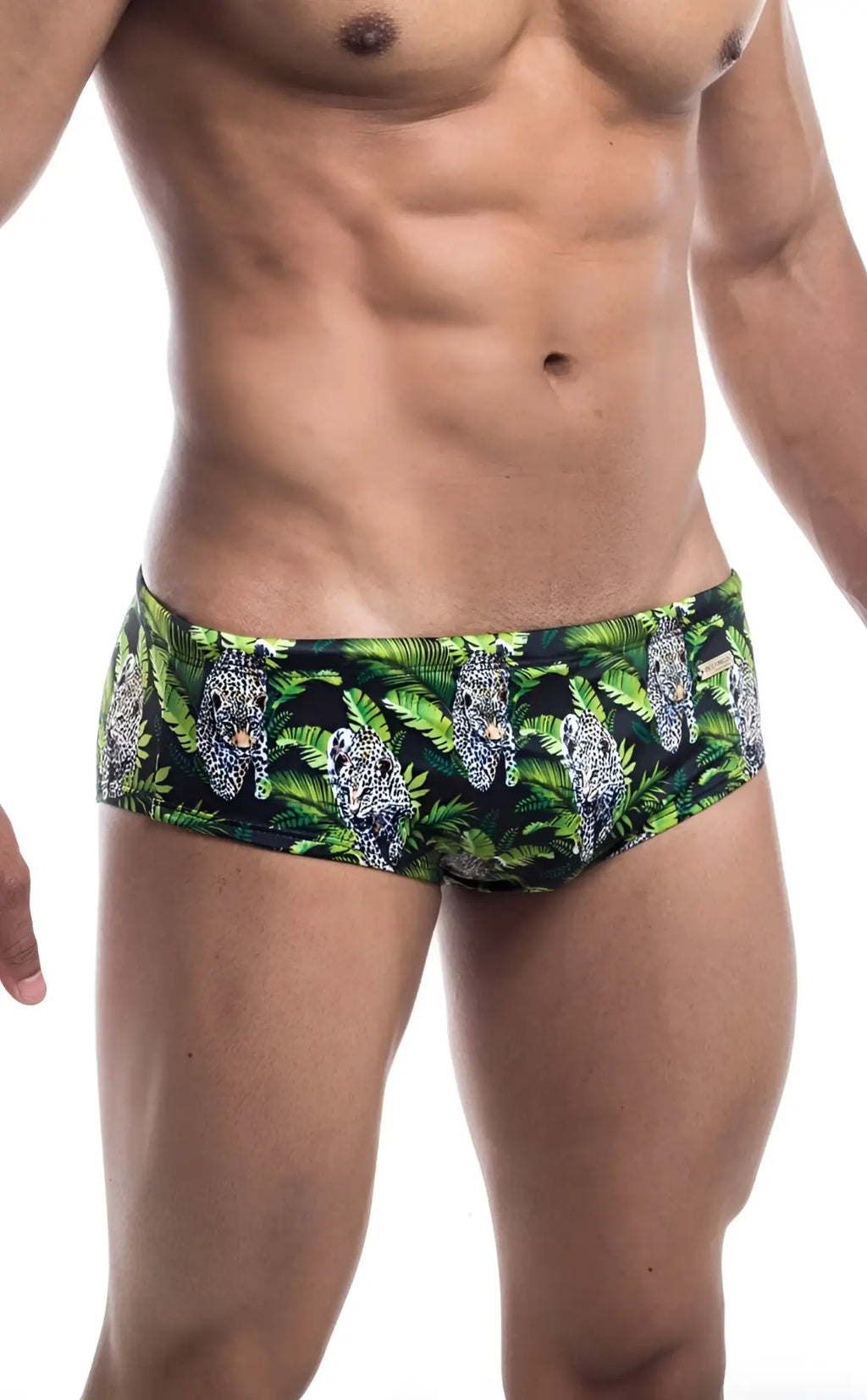 Oceanico swim brief in green and black featuring a bold leopard pattern amid tropical foliage for beachwear