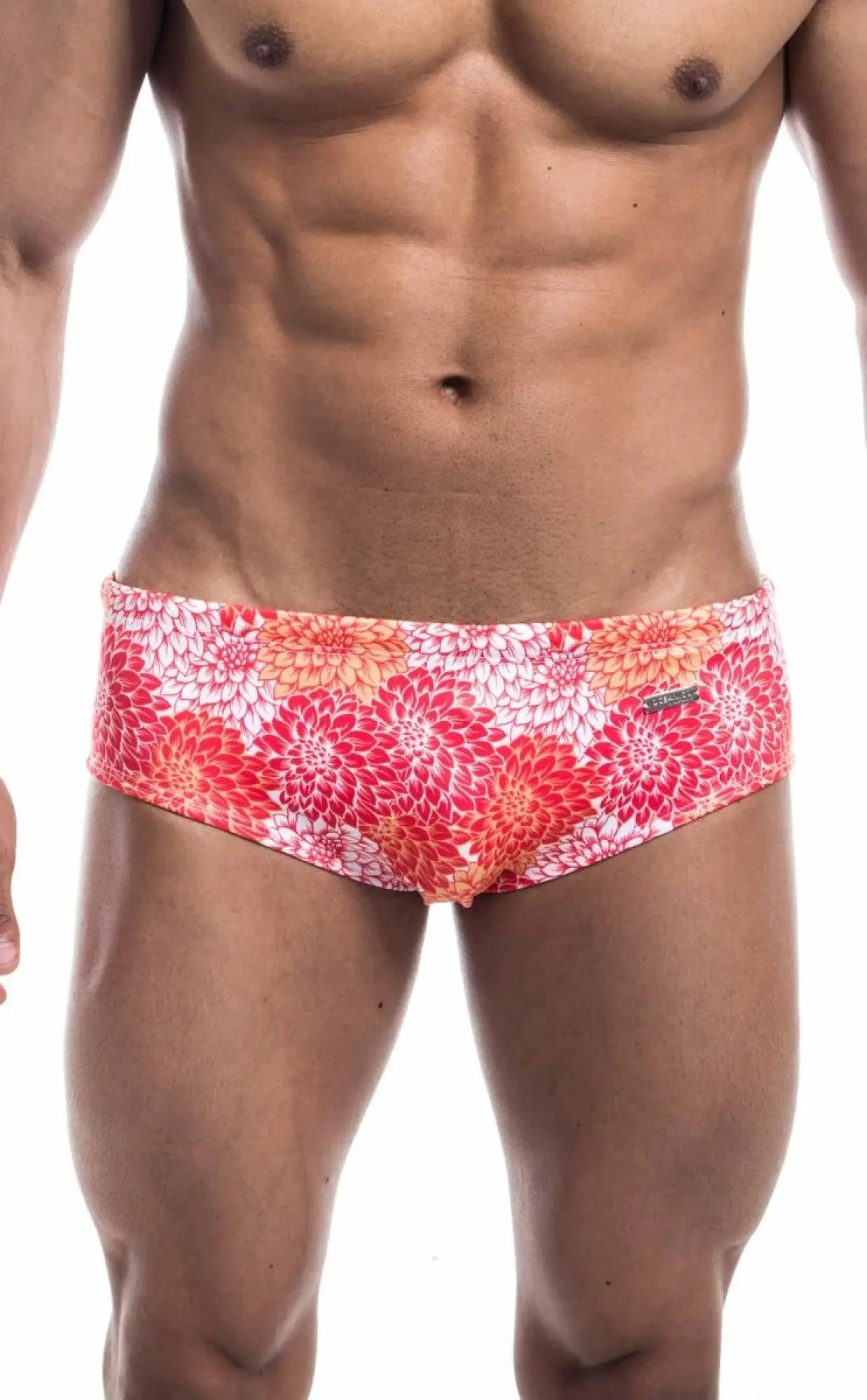 Oceanico swim brief with vibrant pink red and orange floral pattern on white base designed for swimming and beachwear