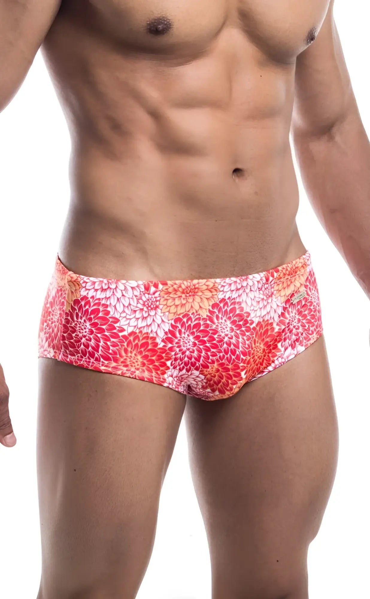 Oceanico swim brief in vibrant pink orange and white floral pattern perfect for beach and pool use