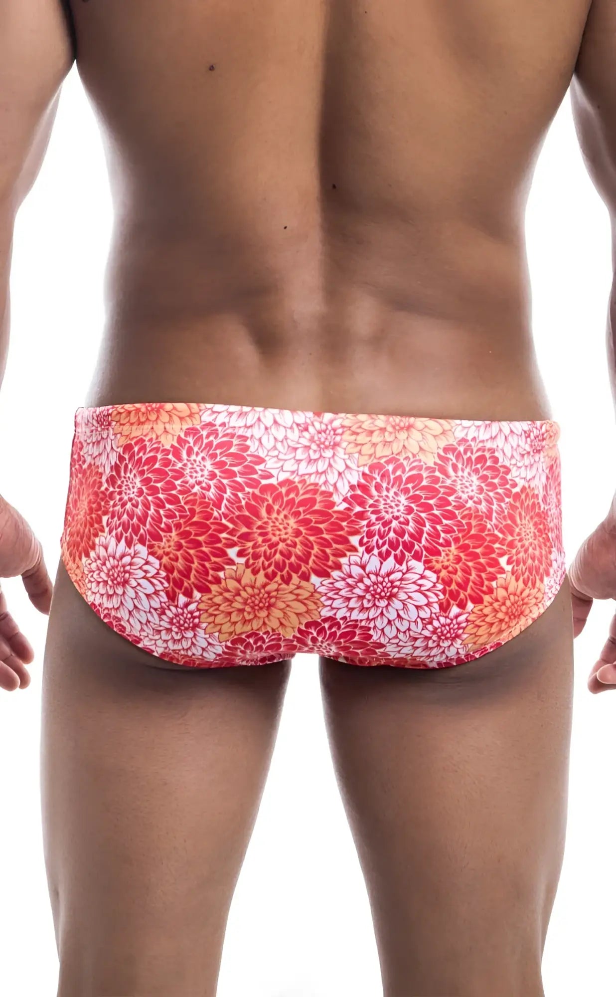 Oceanico swim brief featuring vibrant red and orange floral pattern designed for comfortable beachwear