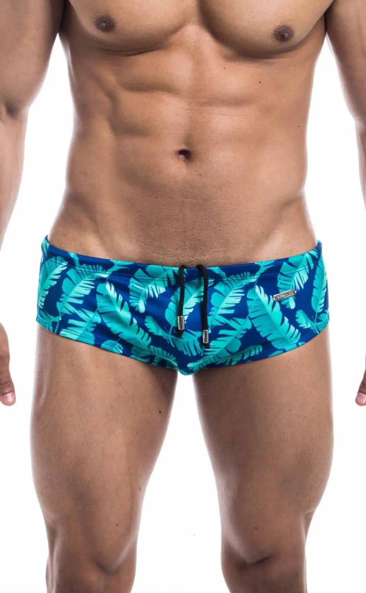 Oceanico swim brief in vibrant turquoise and navy with bold tropical leaf pattern and black drawstring closure