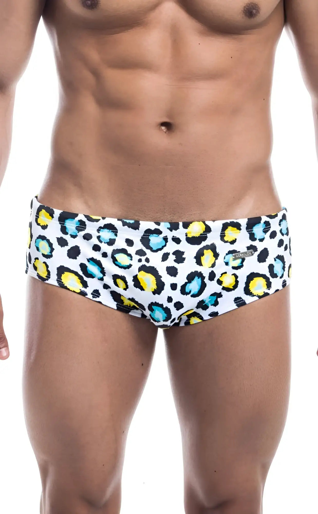 Oceanico swim brief in white featuring bold leopard print with yellow and teal spots for stylish beachwear