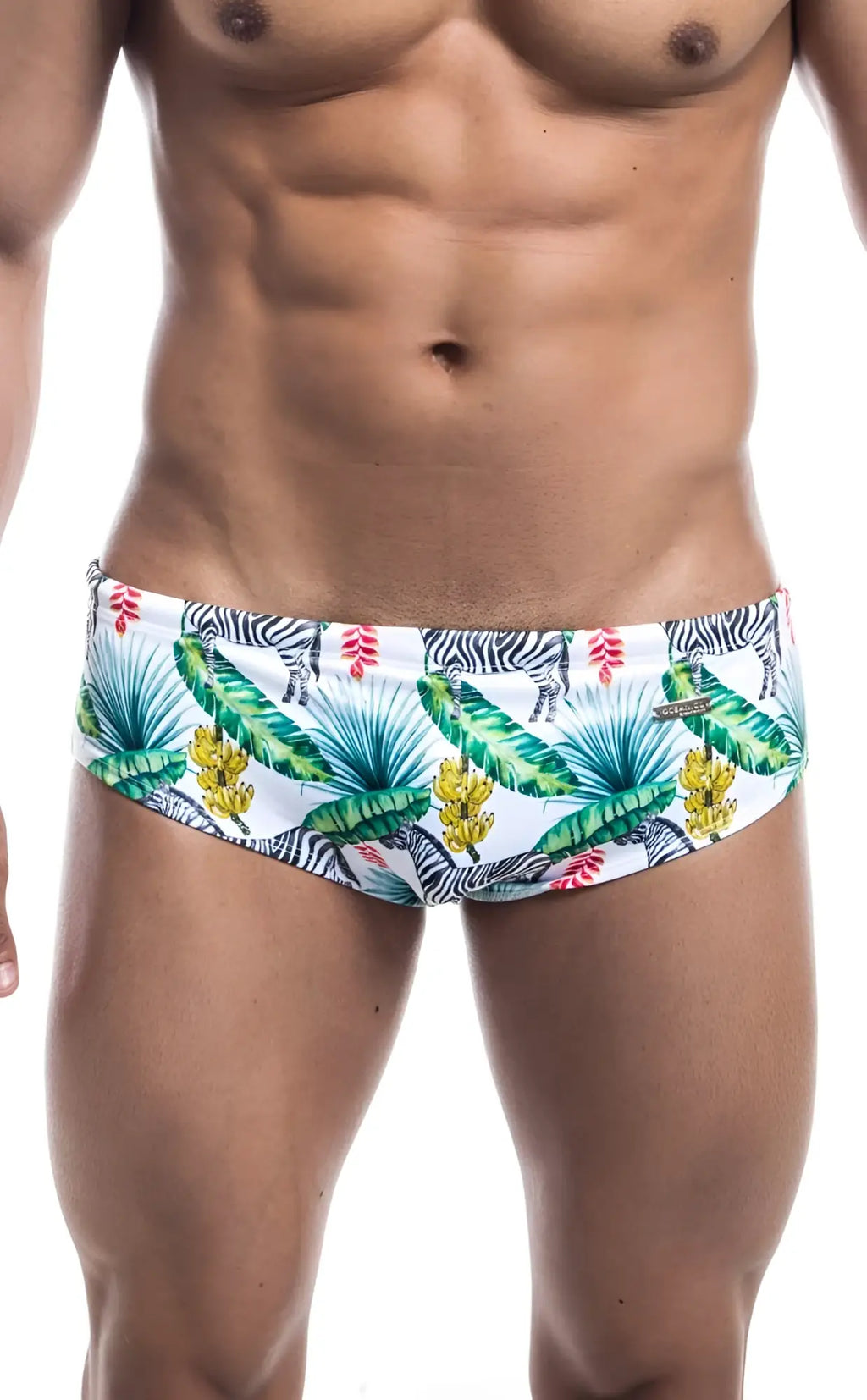 Oceanico swim brief white swim trunks with vibrant tropical pattern of green palm leaves yellow bananas pink flowers and zebras