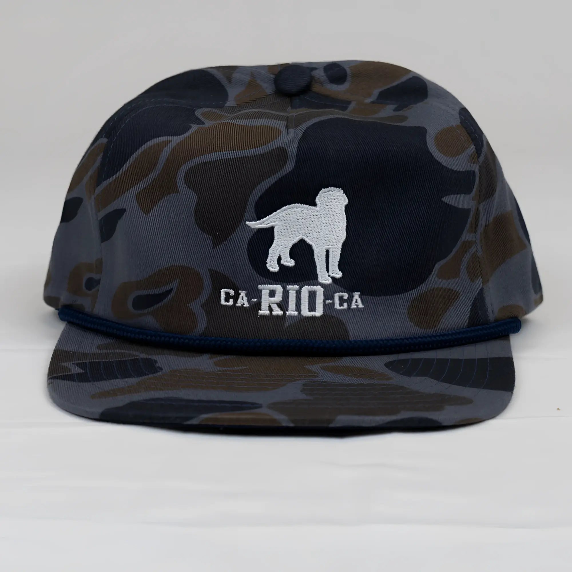 Old school camo unstructured rope hat with navy and brown camouflage snapback and white embroidered dog silhouette