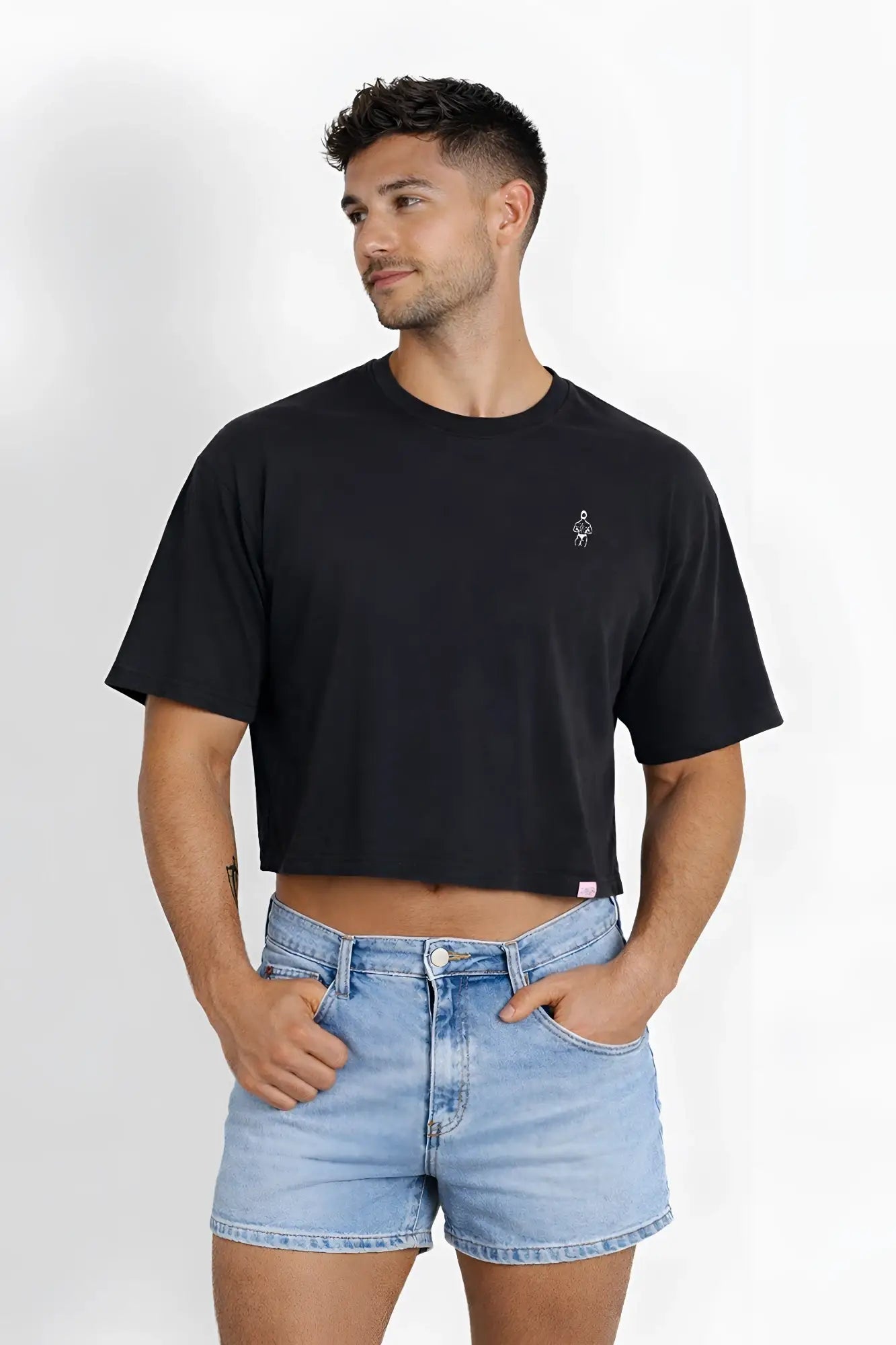 Black oversized relaxed crop top with small embroidered logo on left chest in midnight black color