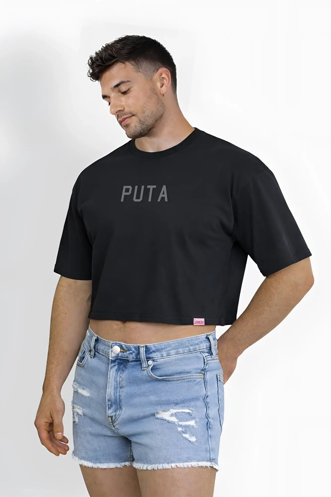 Black oversized relaxed cotton crop top with puta printed in gray across the chest for casual wear