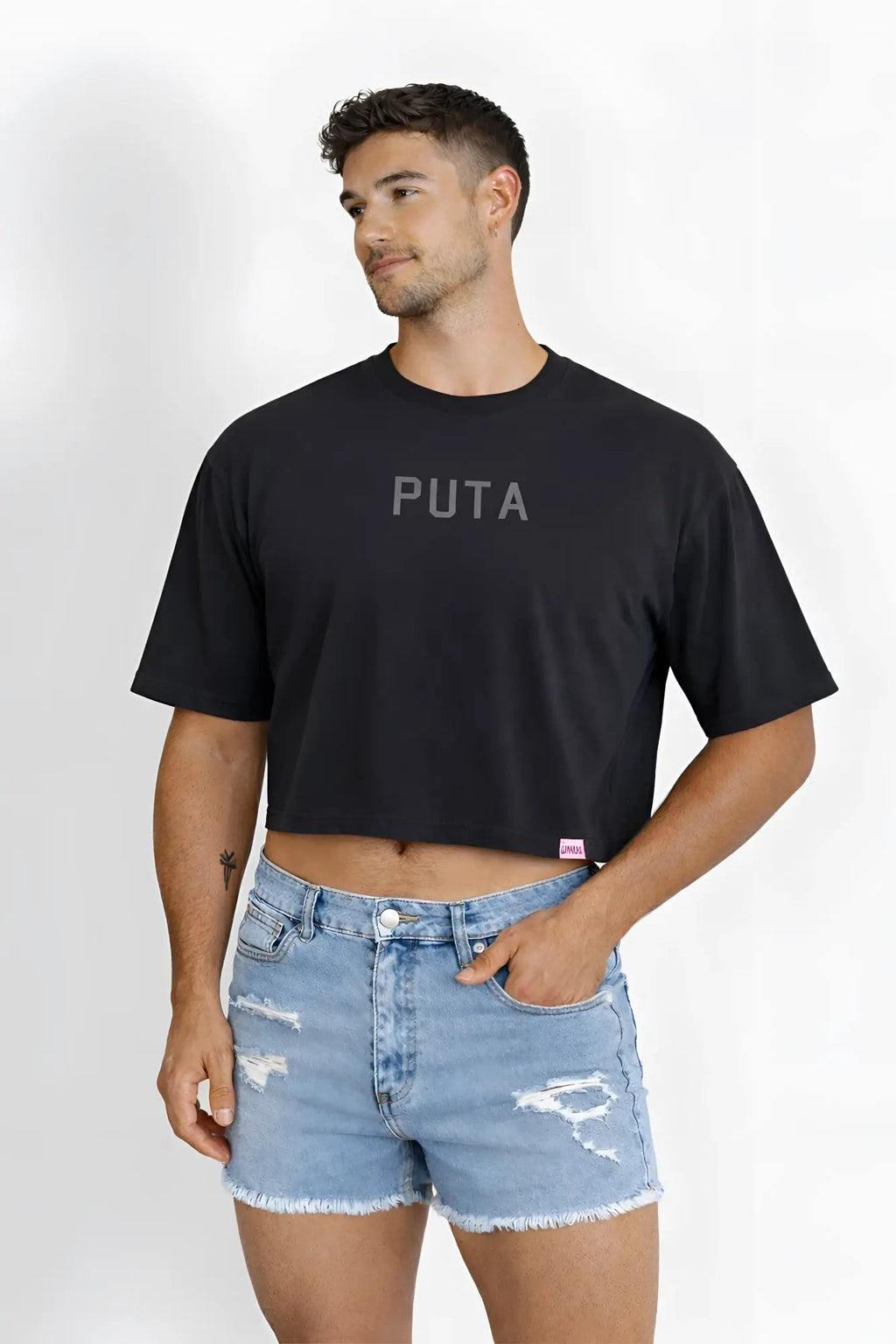 Black oversized relaxed cotton crop top with puta printed in gray across the chest for casual wear