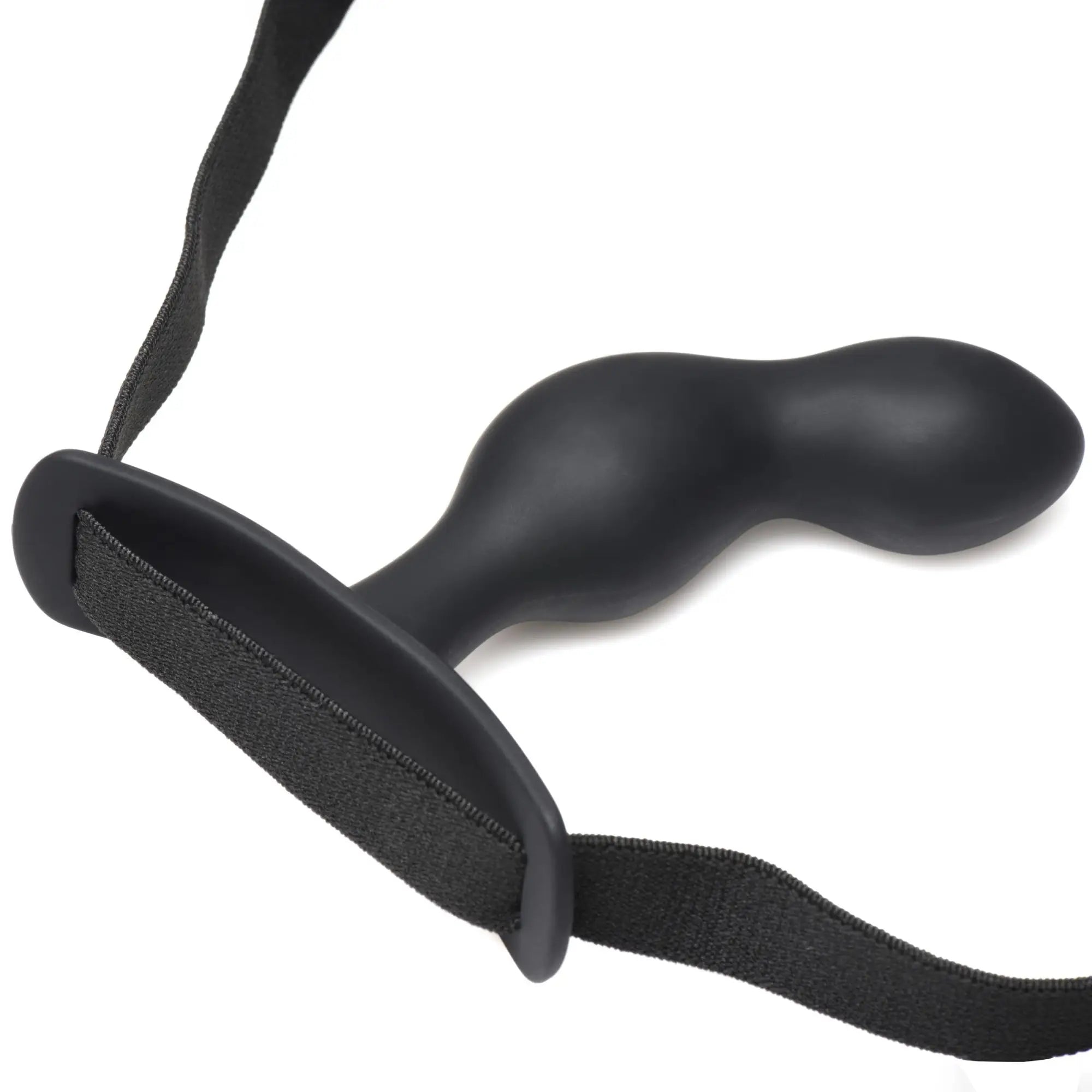 Black silicone p-spot plugger trainer comfort harness with built-in strap for secure handling shown from the back side