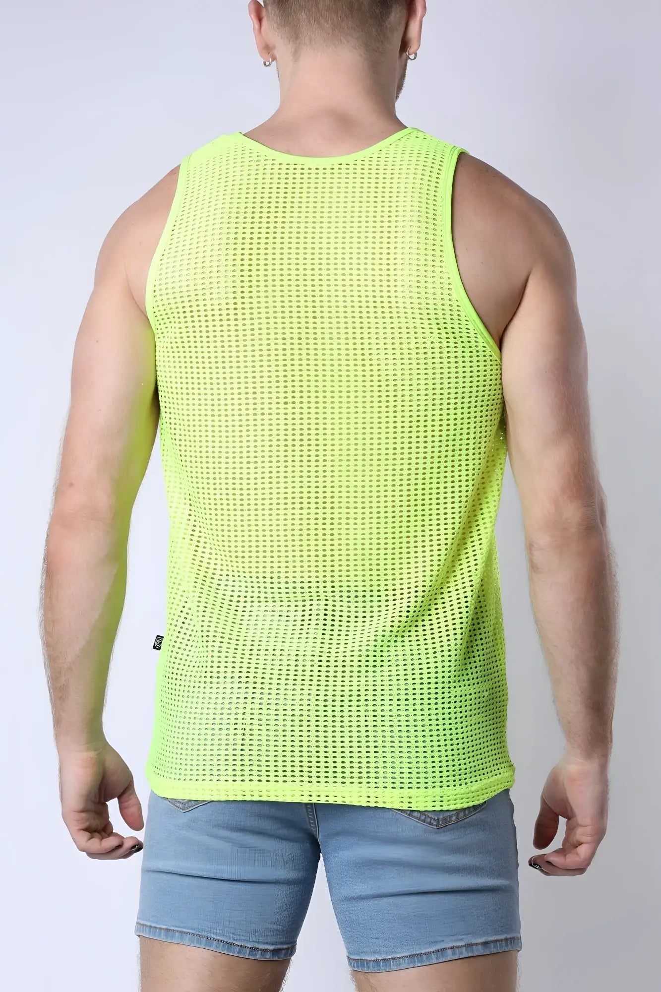 Palm canyon mesh tank top in neon green with a sleeveless design and round neckline made from breathable mesh fabric