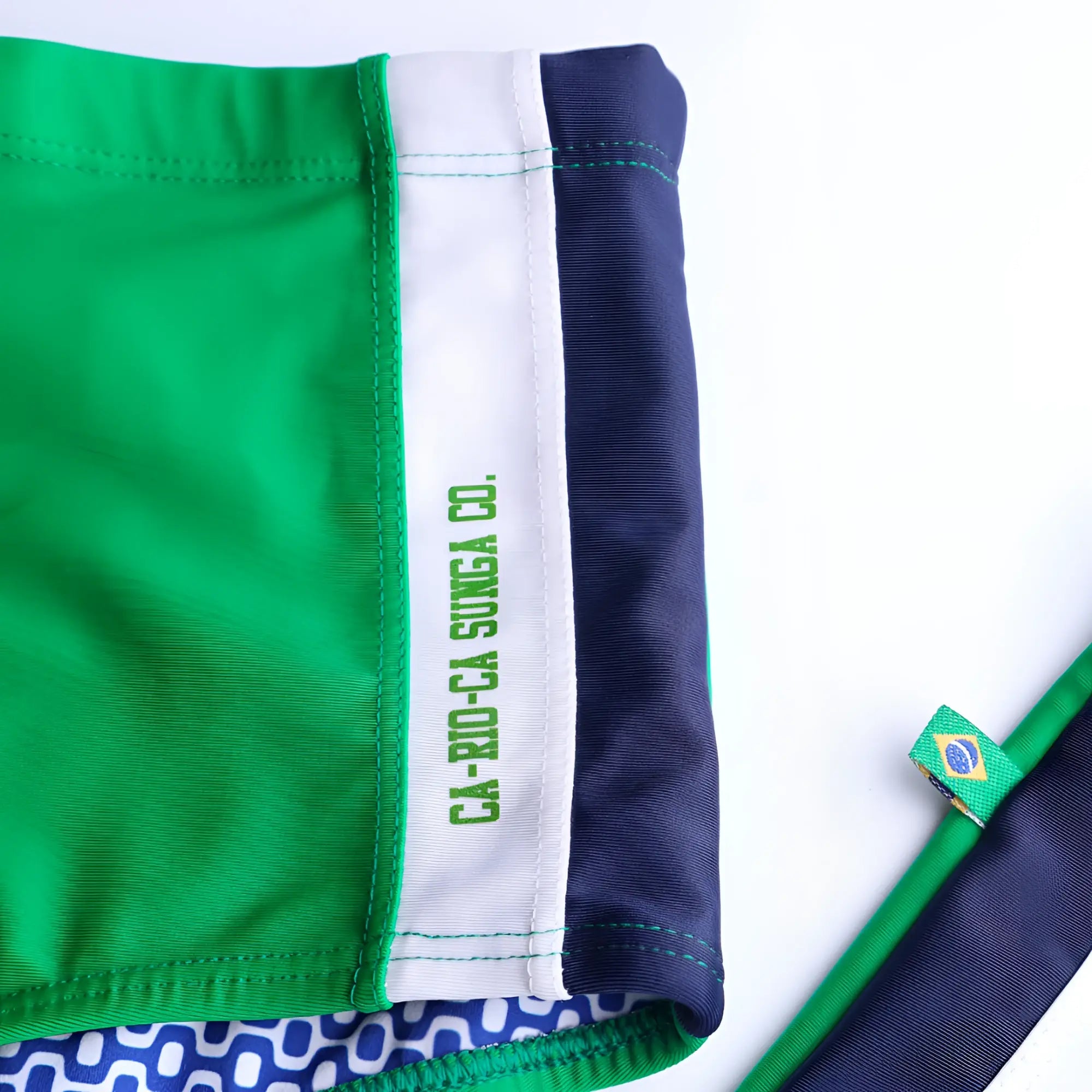 Paraná Trio sunga traditional cut swim shorts in green and navy blue with white trim and ca-rio-ca sunga co logo waistband