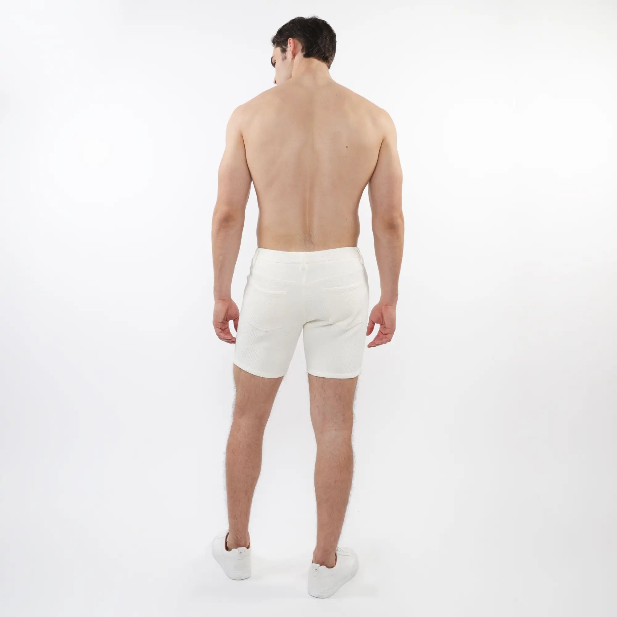 White parquet jacquard stretch knit athletic shorts with a clean minimalist design for active use