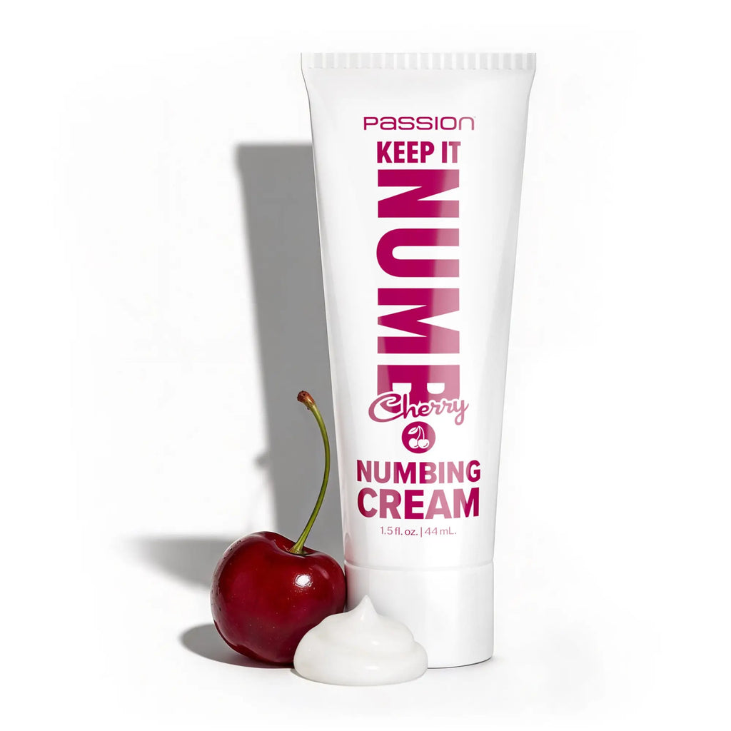 Passion Keep It Numb 1.5oz cherry-flavored numbing cream tube with a fresh cherry and a dollop of white cream.
