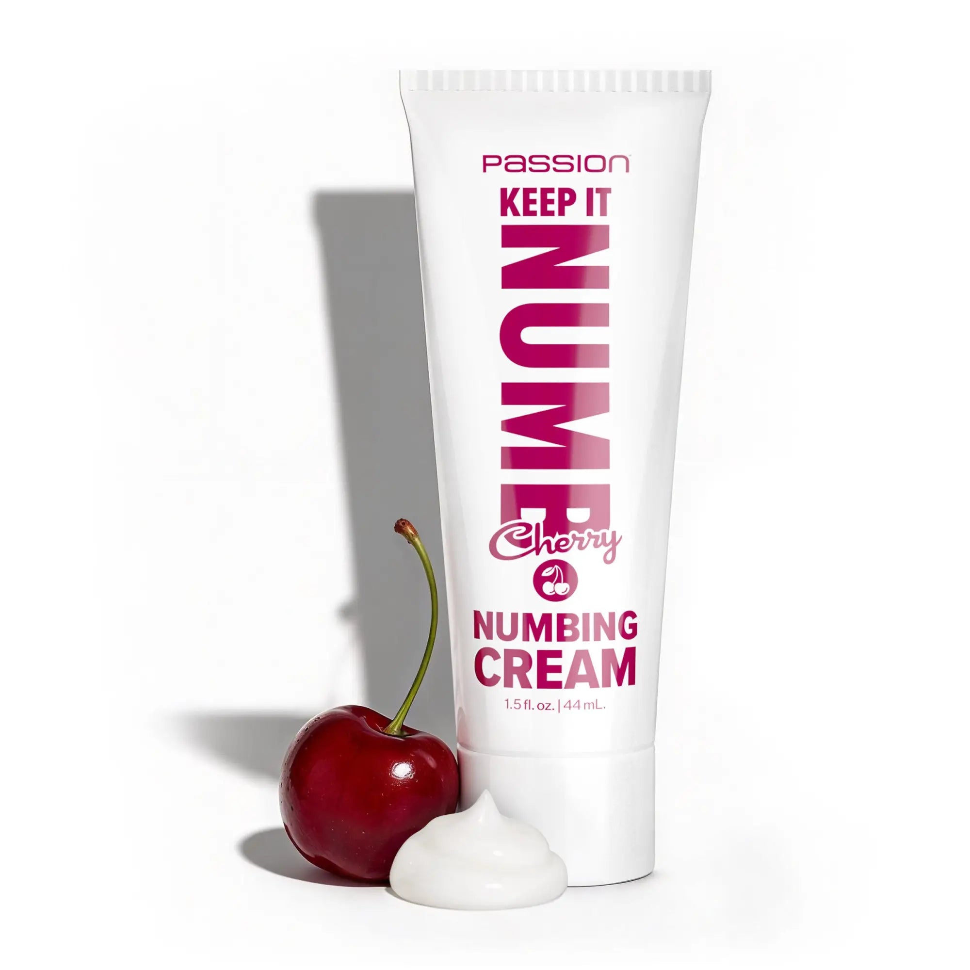 Passion Keep It Numb 1.5oz cherry-flavored numbing cream tube with a fresh cherry and a dollop of white cream.