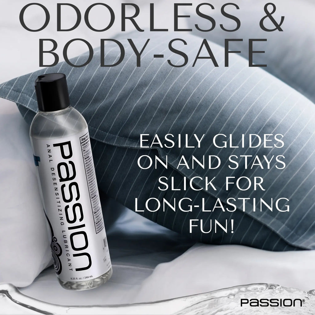 Passion 8.25oz Maximum Strength Desensitizing Lube bottle placed against a blue pinstriped pillow.