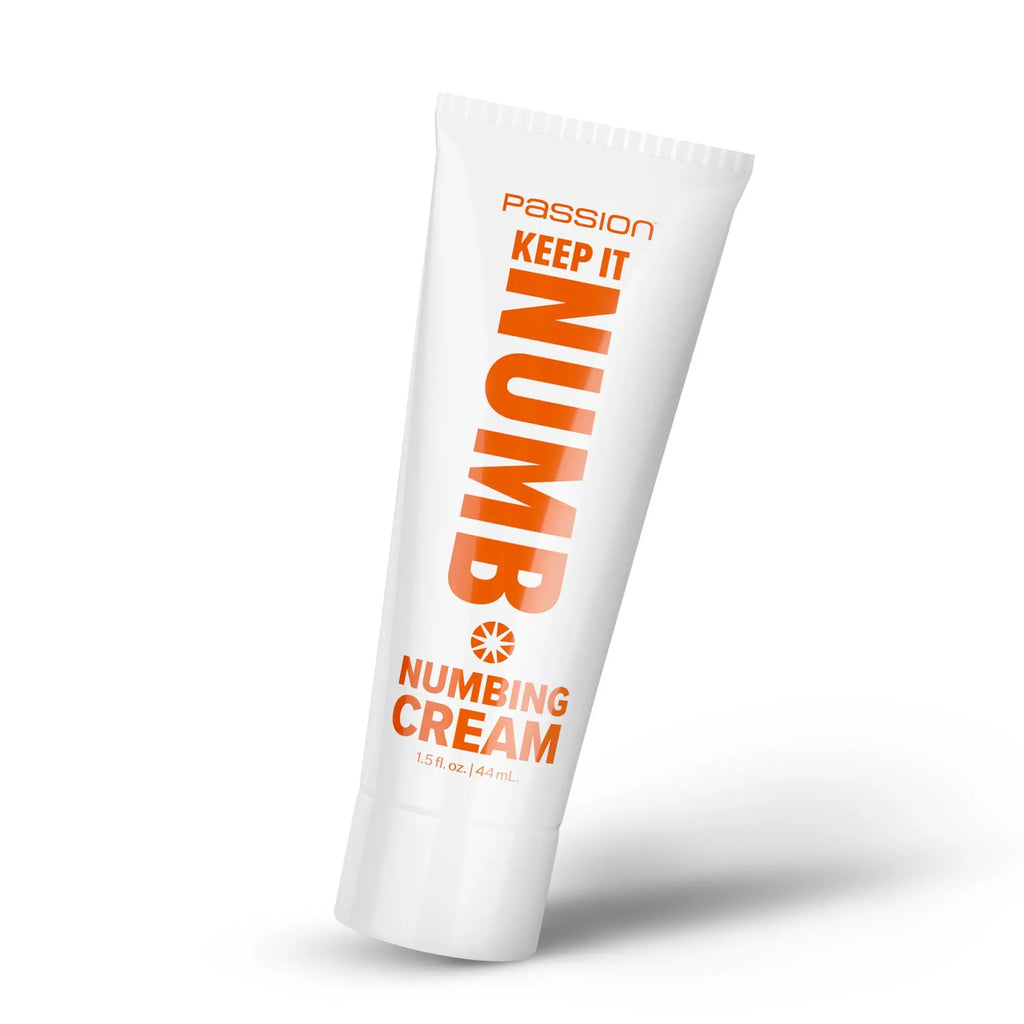 White Passion Keep It Numb numbing cream tube with bold orange text on a white background.