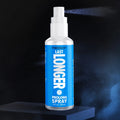 Passion Last Longer Prolong Spray bottle with blue label, white cap, and fine mist against a dark background.