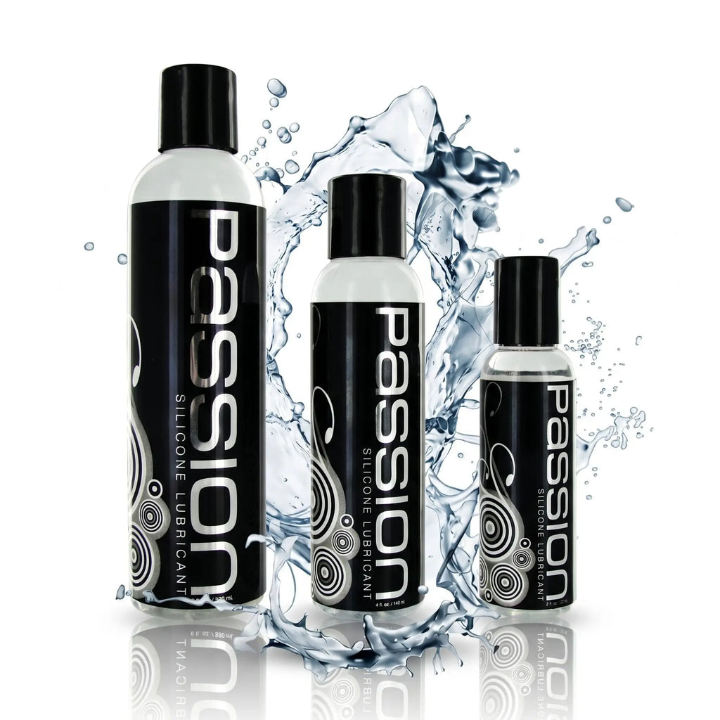 Three bottles of Passion Silicone-Based Lubricant in varying sizes with black labels, set against a water splash.