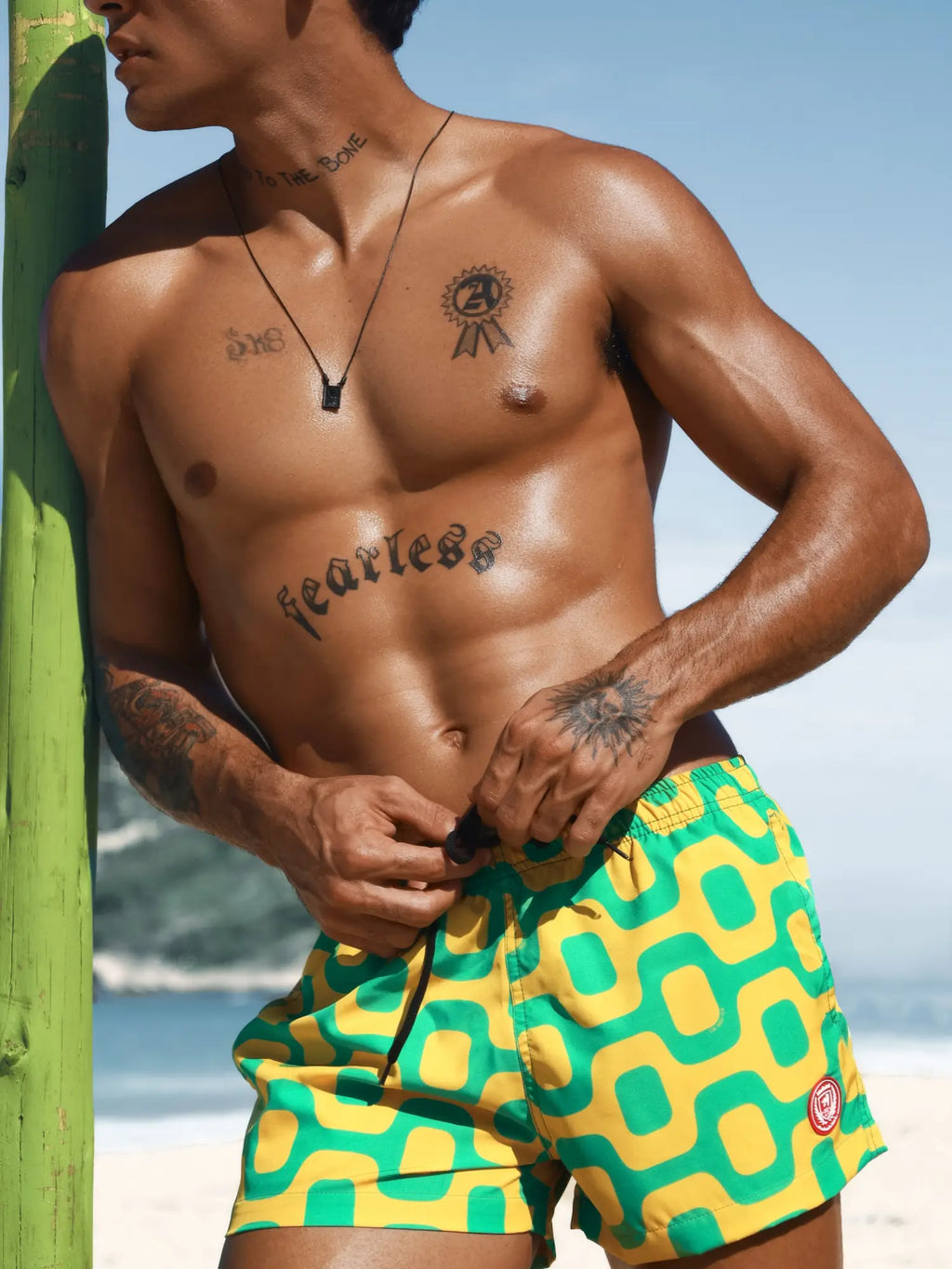 Pavement shorts italian shorts in vibrant green and yellow geometric pattern with drawstring waistband for swimwear