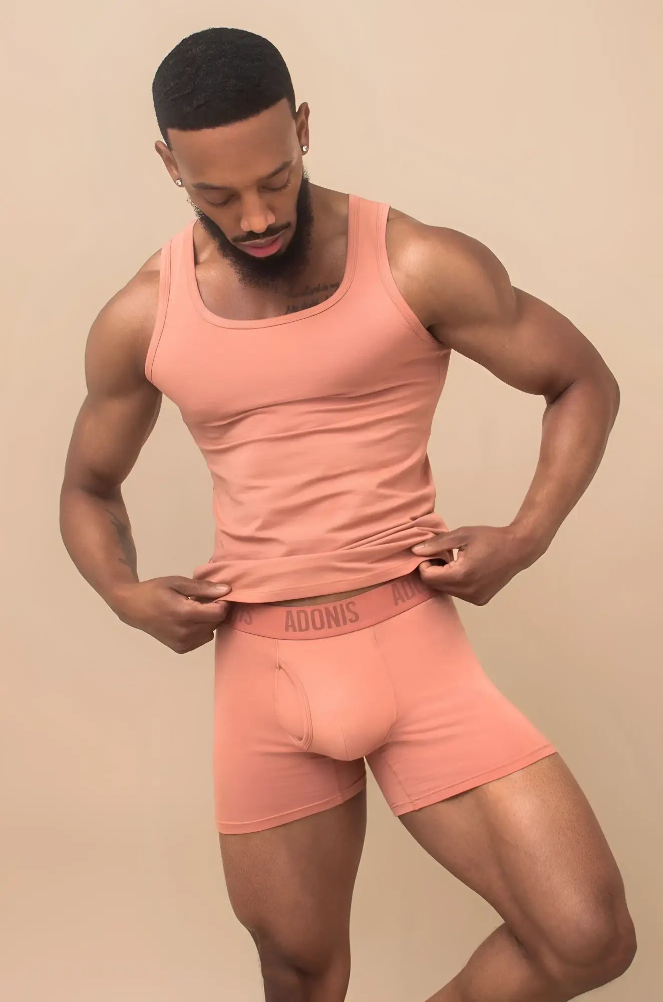 Peach-colored adonis brand men’s briefs and matching tank top in a peach cream 2-piece set, soft fabric for comfort
