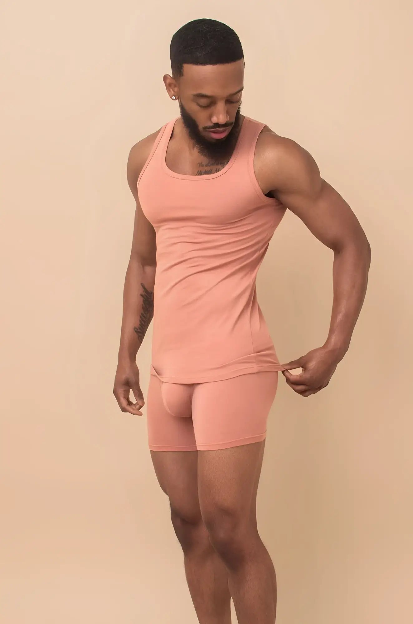 Peach cream 2-piece set featuring a peach-colored form-fitting tank top and matching shorts perfect for casual wear