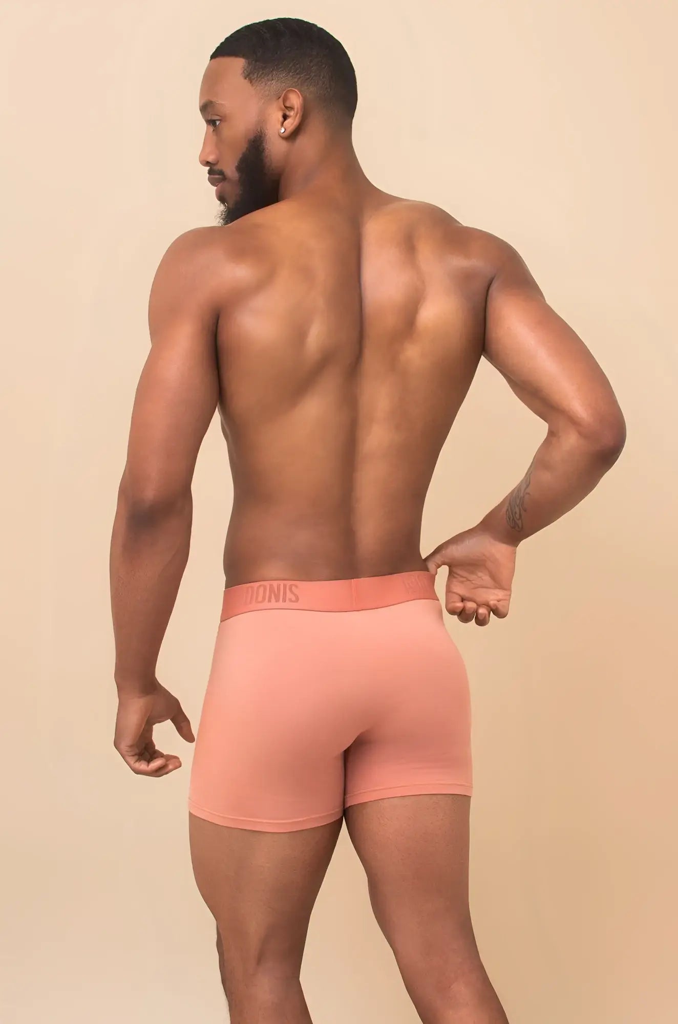 Coral pink briefs with matching elastic waistband featuring tonis branding in peach cream 2-piece set