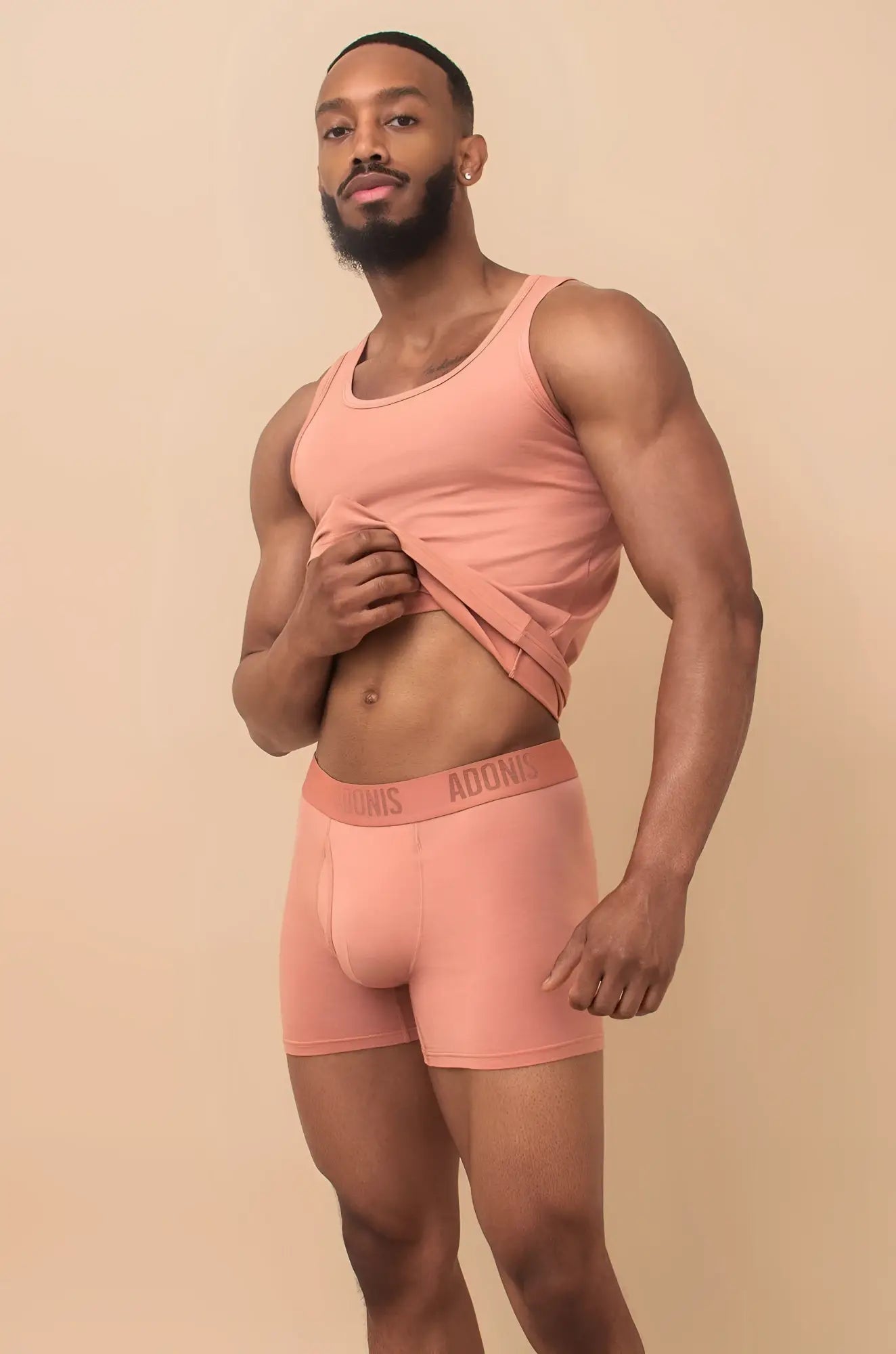 A pair of peach-colored seamless briefs with a soft elastic waistband branded adonis from the peach cream 2-piece set